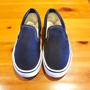 Classic black and white Vans slip ons